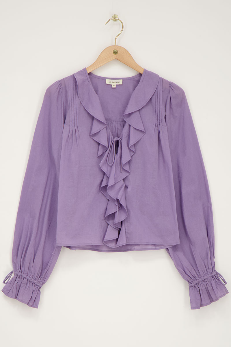 Purple blouse with ruffles and bows