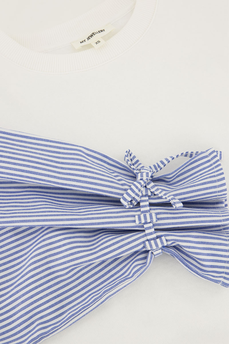 White sweater with striped sleeves