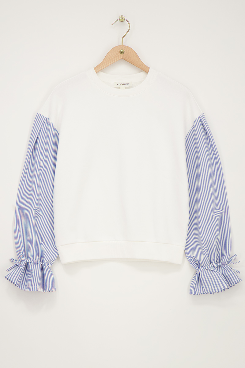 White sweater with striped sleeves