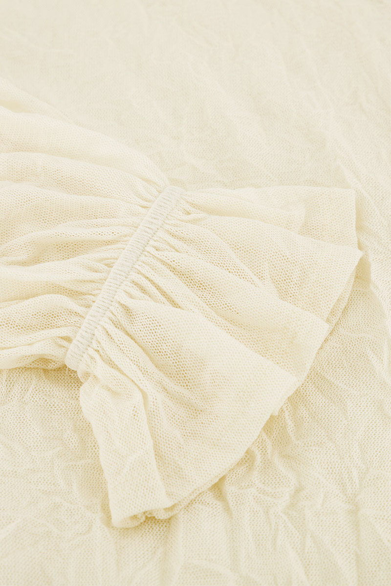 White textured top with cuff